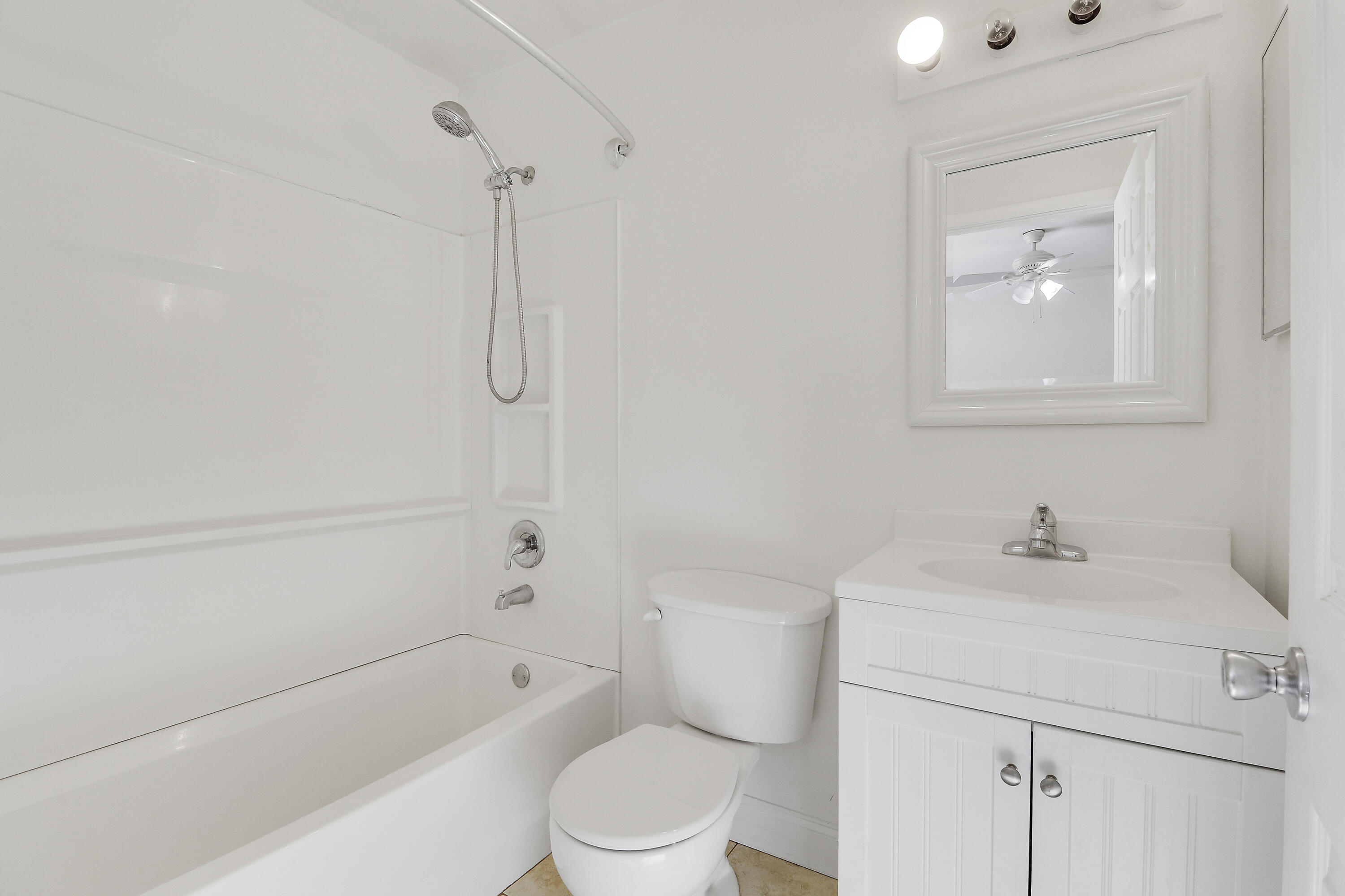 6264 Allen Street Jupiter, FL 33458 - Photo 24 of 27 a bathroom with a sink a toilet and shower