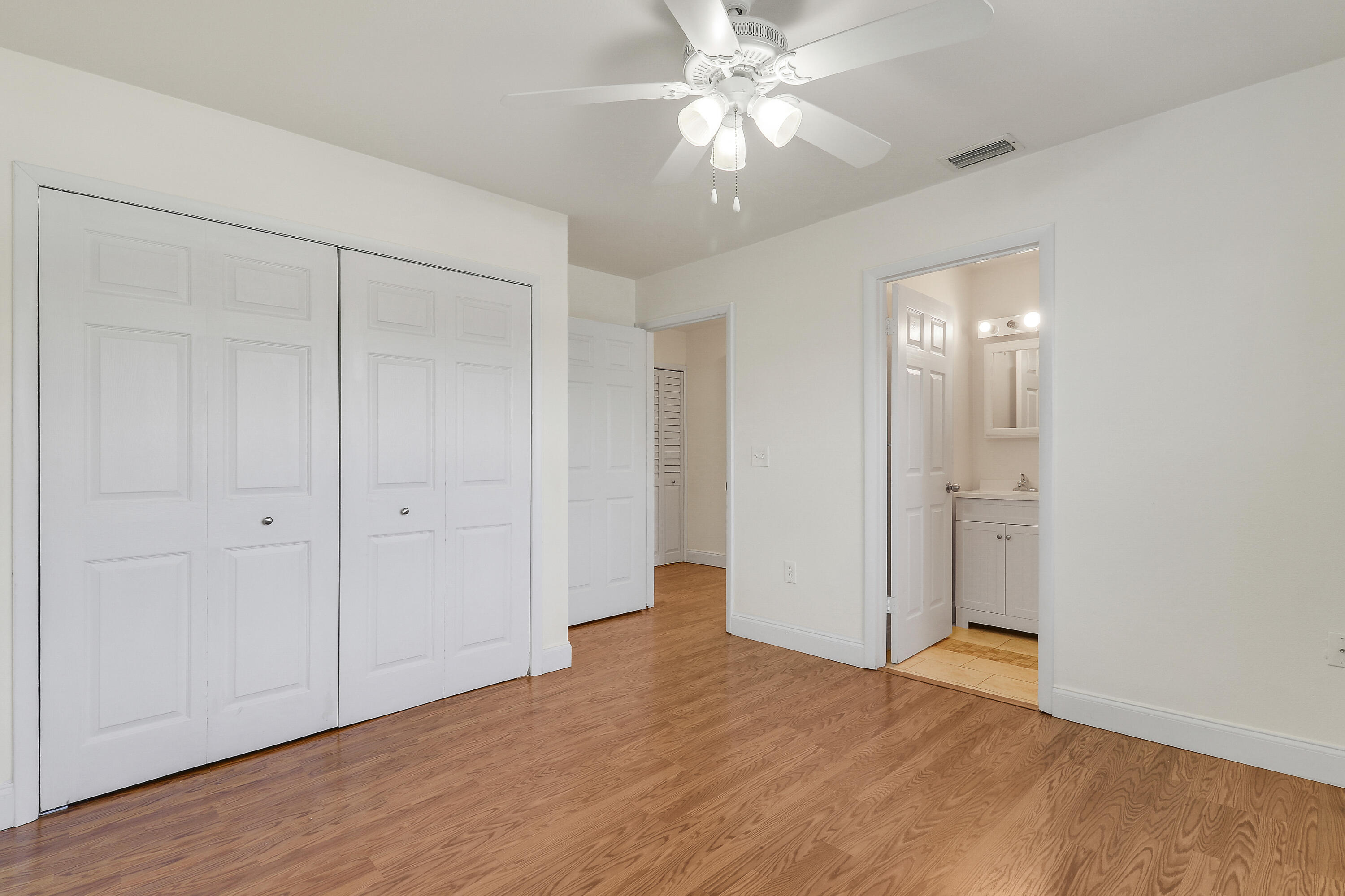6264 Allen Street Jupiter, FL 33458 - Photo 26 of 27 a view of an empty room with a fan