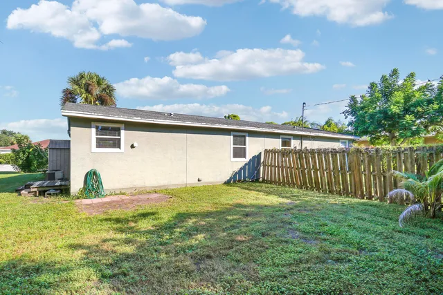 a view of a backyard with a sitting area