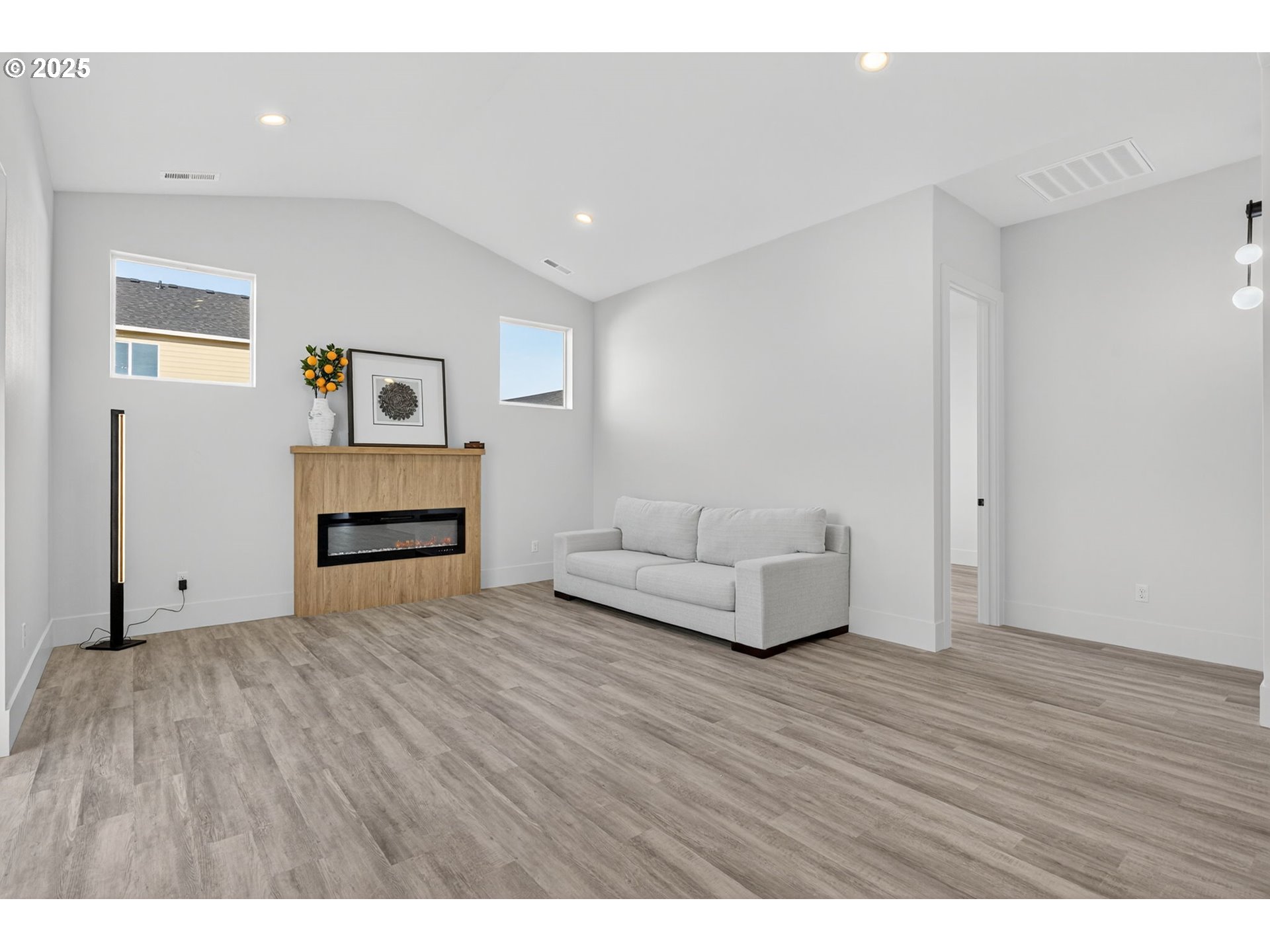 632 Southeast 35th Street Battle Ground, WA 98604 - Photo 13 of 34 a living room with furniture and a wooden floor