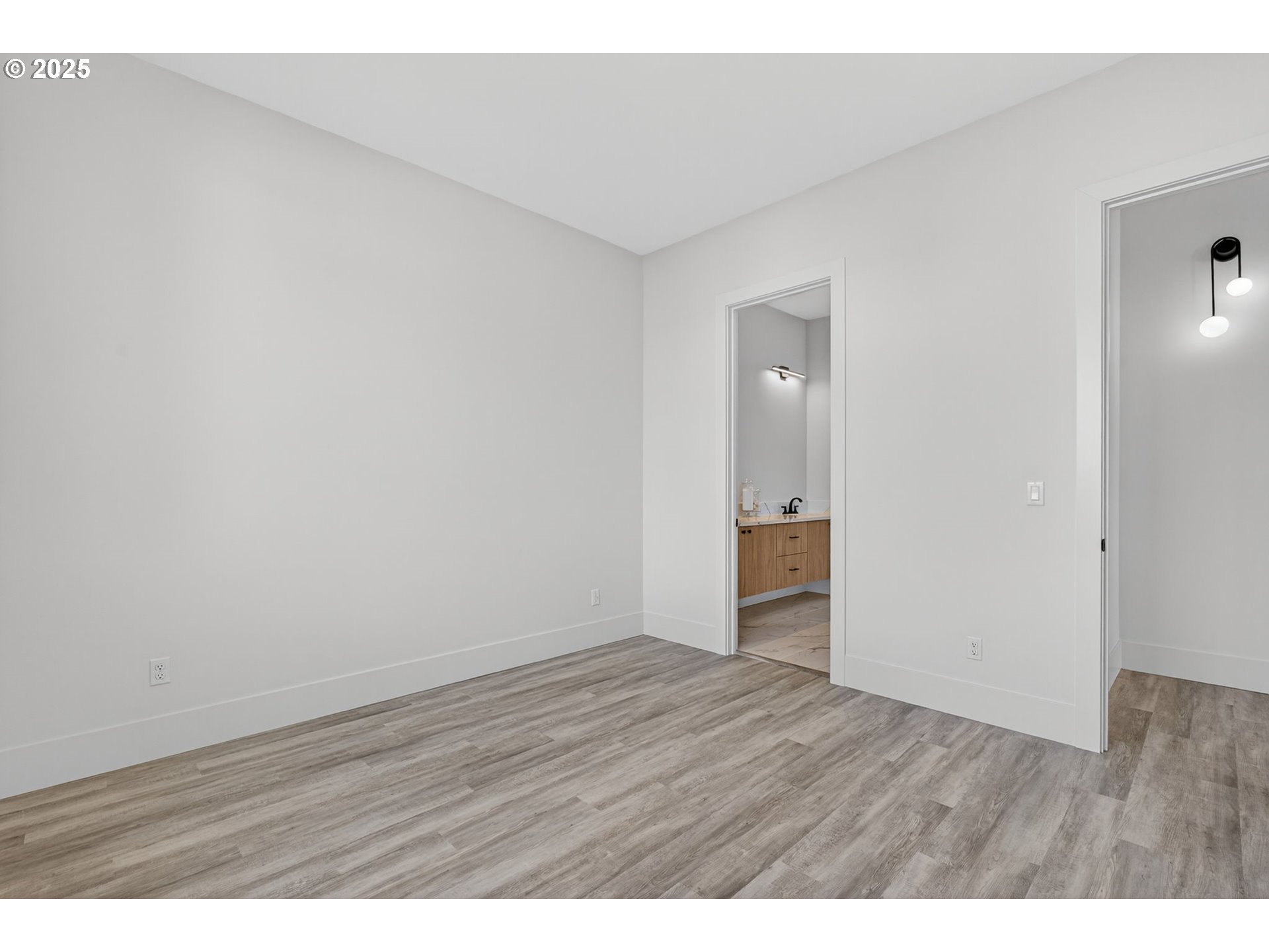 632 Southeast 35th Street Battle Ground, WA 98604 - Photo 18 of 34 a view of an empty room and wooden floor