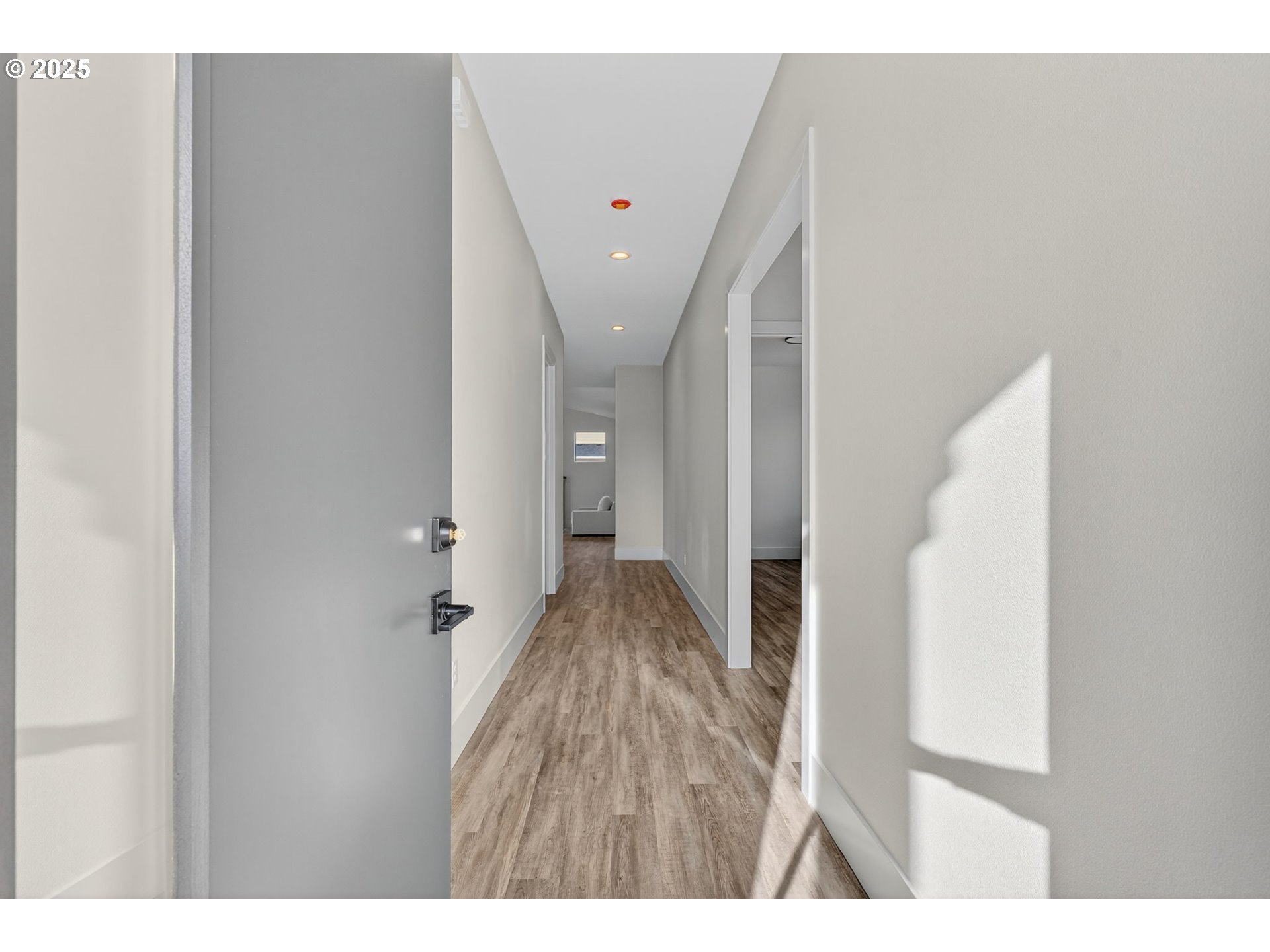 632 Southeast 35th Street Battle Ground, WA 98604 - Photo 2 of 34 a view of a hallway with wooden floor and staircase