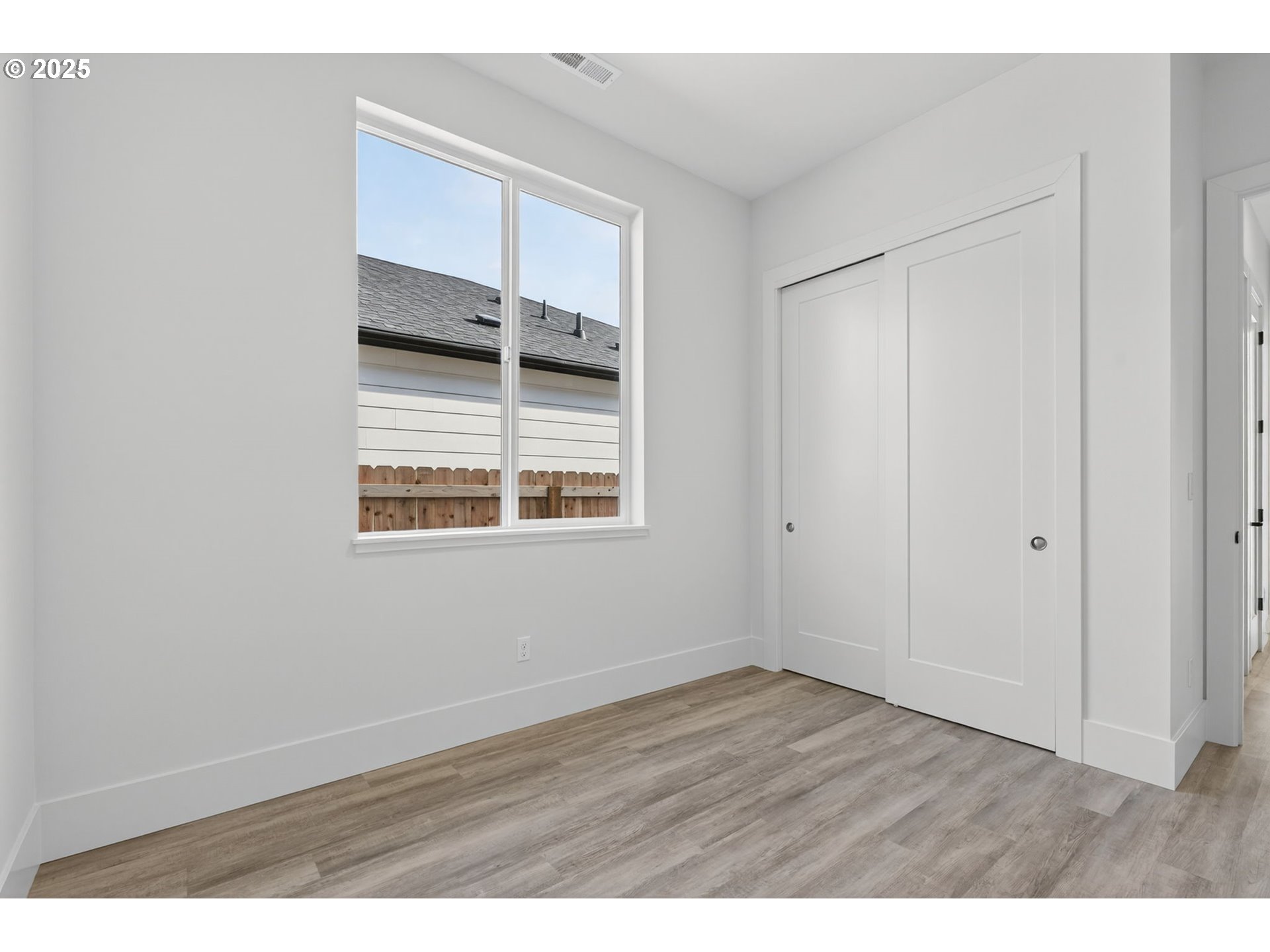 632 Southeast 35th Street Battle Ground, WA 98604 - Photo 28 of 34 a view of empty room with wooden floor and fan