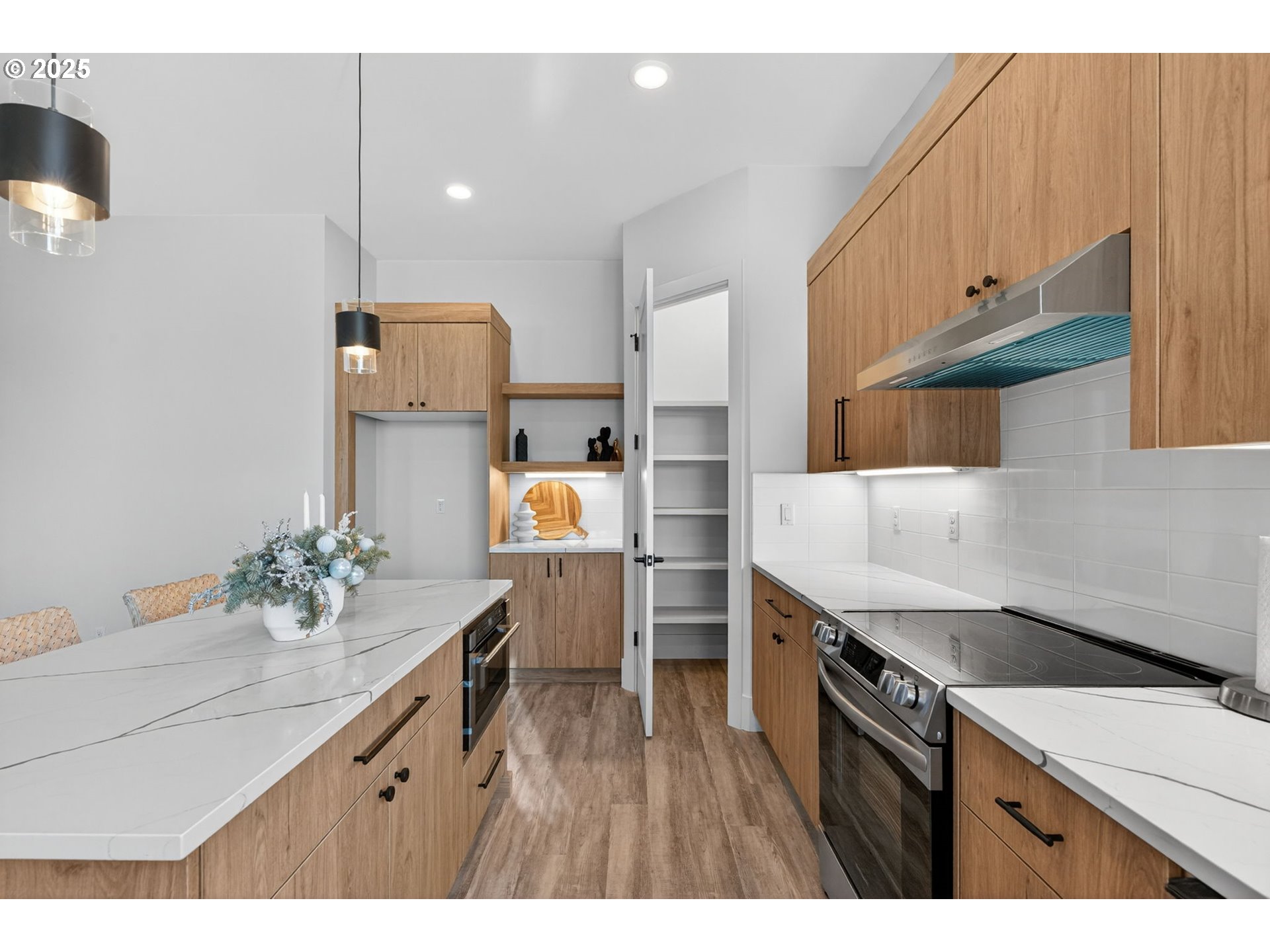 632 Southeast 35th Street Battle Ground, WA 98604 - Photo 8 of 34 a kitchen with a sink cabinets and wooden floor