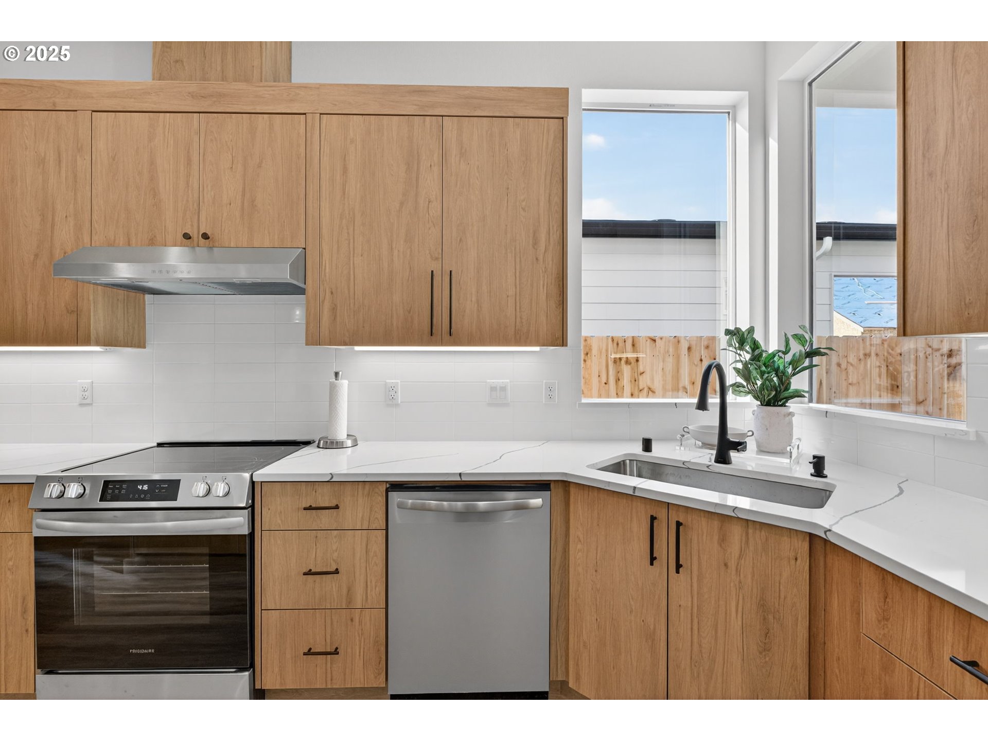 632 Southeast 35th Street Battle Ground, WA 98604 - Photo 9 of 34 a kitchen with a sink stove and cabinets