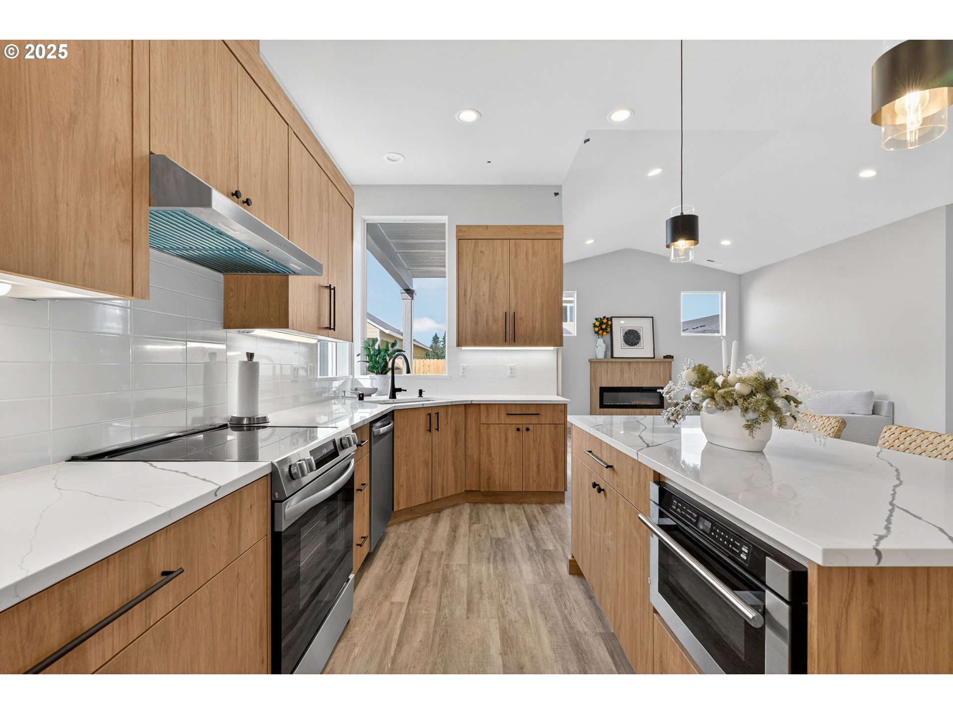 632 Southeast 35th Street Battle Ground, WA 98604 - Photo 10 of 34 a kitchen with a sink stove cabinets and wooden floor
