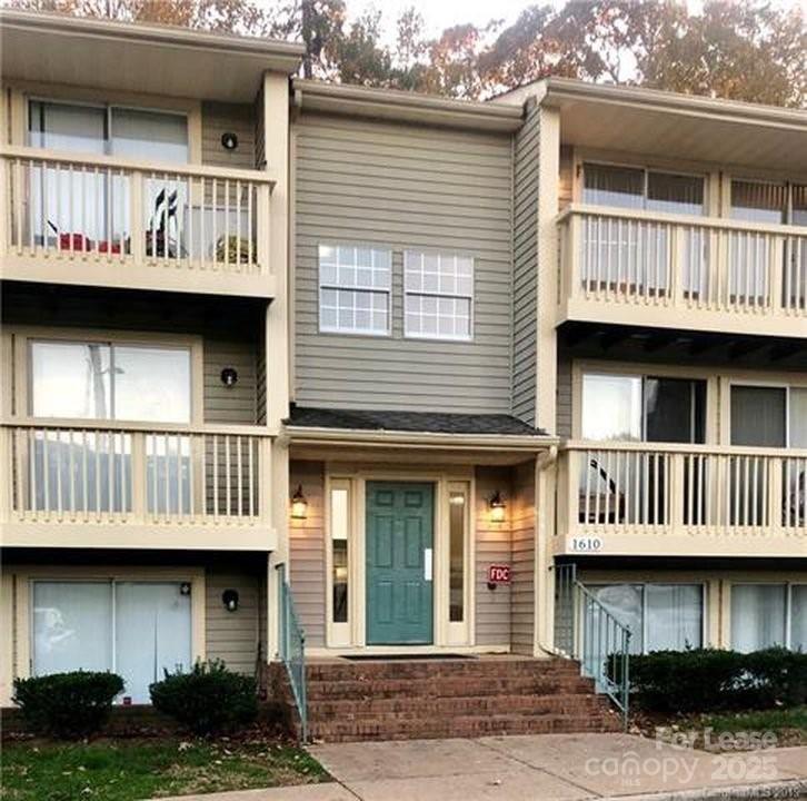 1610 Arlyn Circle Charlotte, NC 28213 - Photo 1 of 25 a view of a brick house with large windows