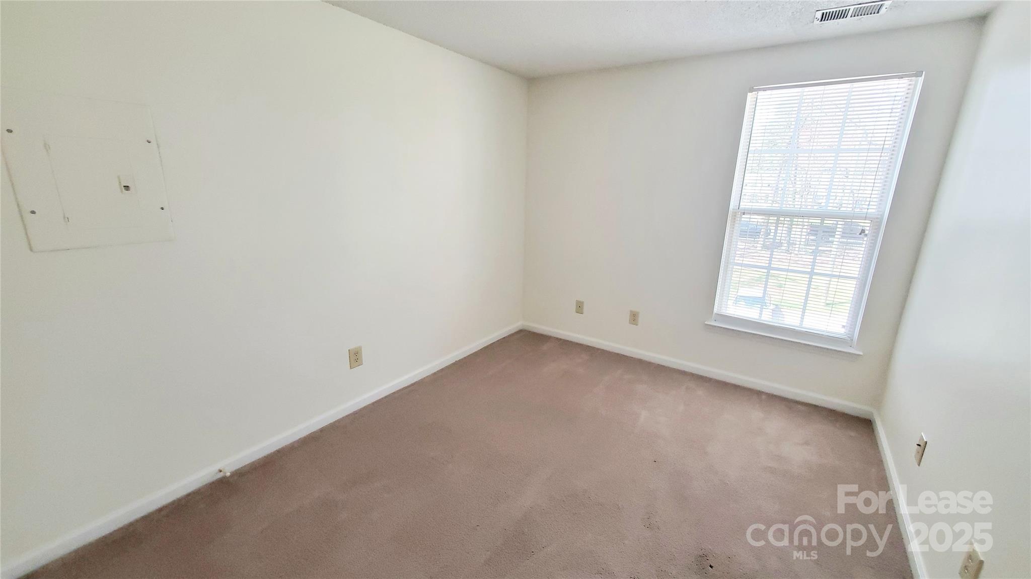 1610 Arlyn Circle Charlotte, NC 28213 - Photo 14 of 25 an empty room with a window