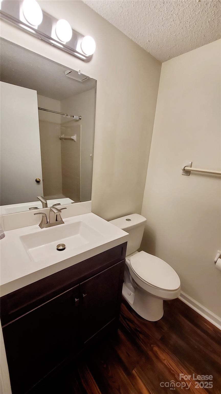 1610 Arlyn Circle Charlotte, NC 28213 - Photo 23 of 25 a bathroom with a sink toilet and a mirror