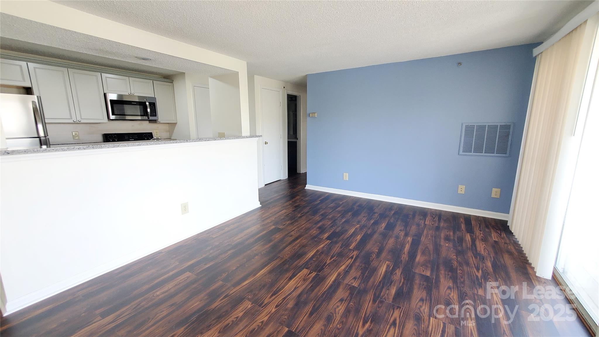 1610 Arlyn Circle Charlotte, NC 28213 - Photo 9 of 25 a view of a kitchen with wooden floor and a sink