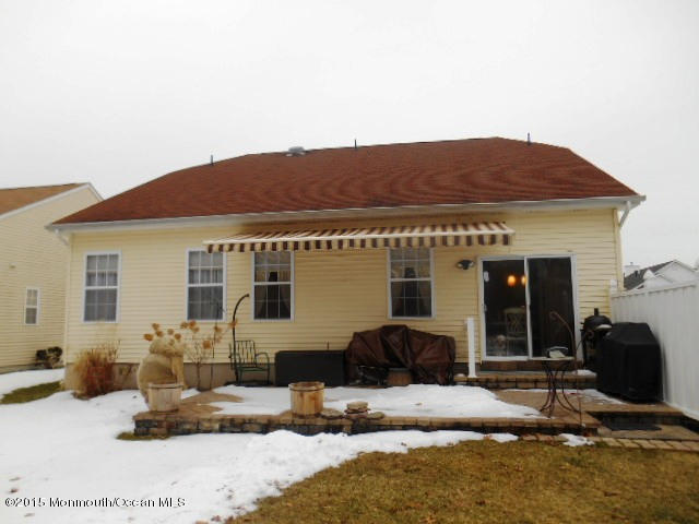 87 Maypink Lane Howell, NJ 07731 - Photo 25 of 25 87 Maypink back patio and awning