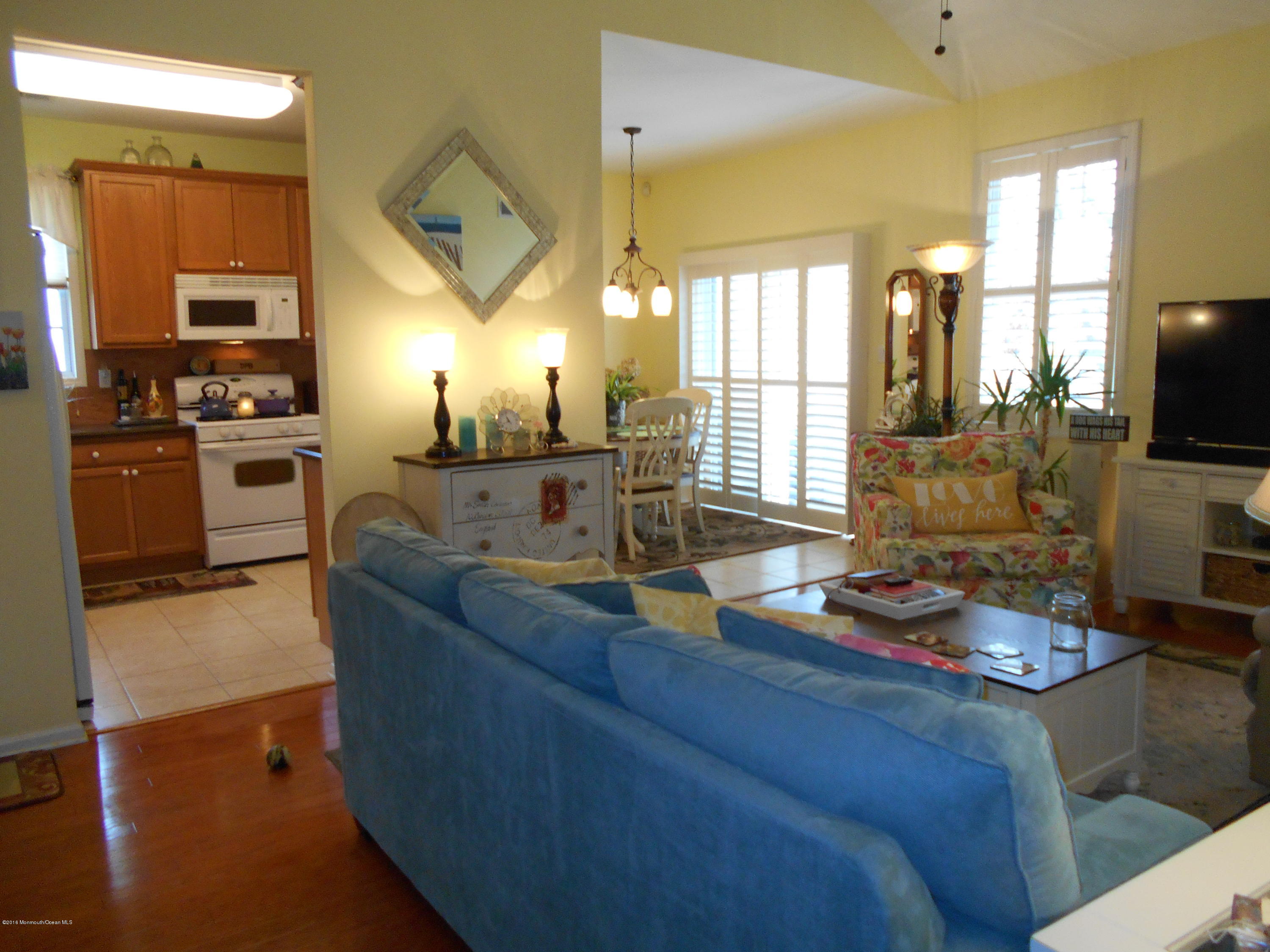 87 Maypink Lane Howell, NJ 07731 - Photo 10 of 25 Great room looking to kitchen