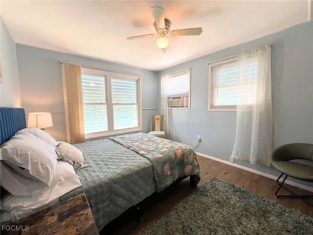 a bedroom with a bed a table and chair