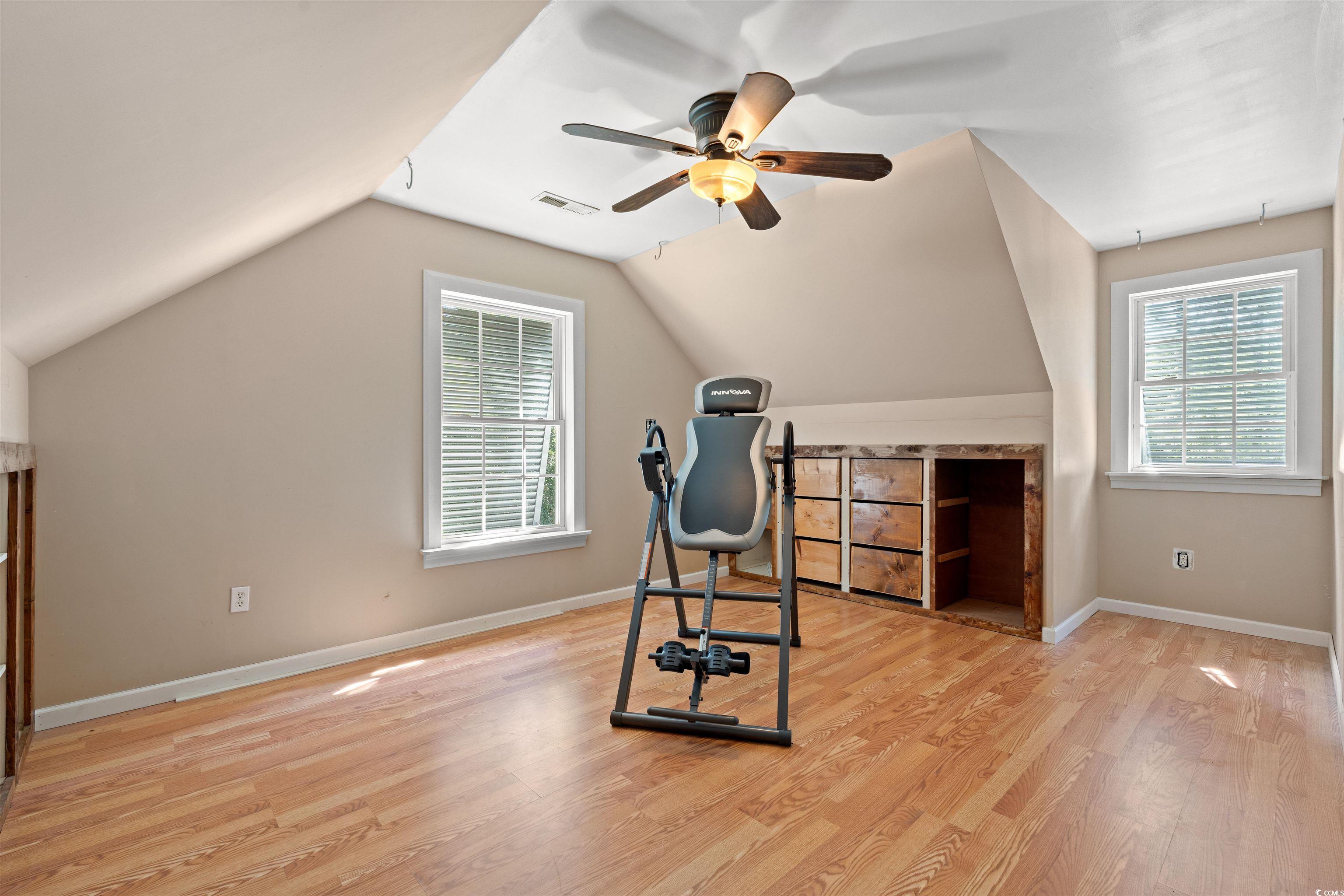 938 Fox Hollow Road Conway, SC 29526 - Photo 15 of 39 Workout room with plenty of natural light, wood finished floors, ceiling fan, and vaulted ceiling