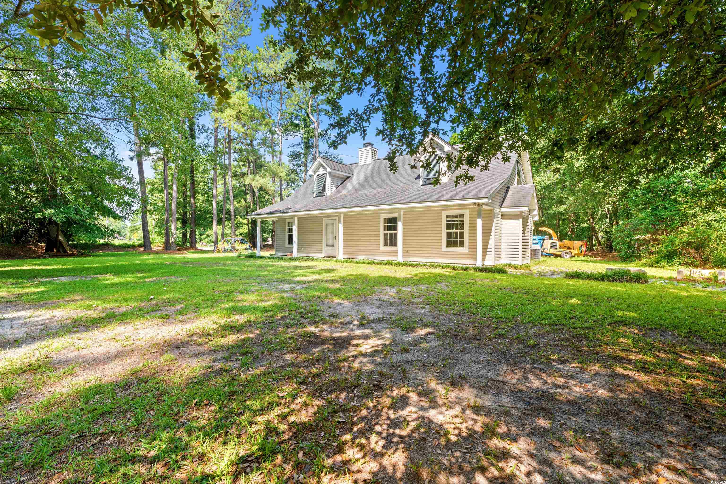 938 Fox Hollow Road Conway, SC 29526 - Photo 22 of 39 Rear view of property with a yard and a chimney