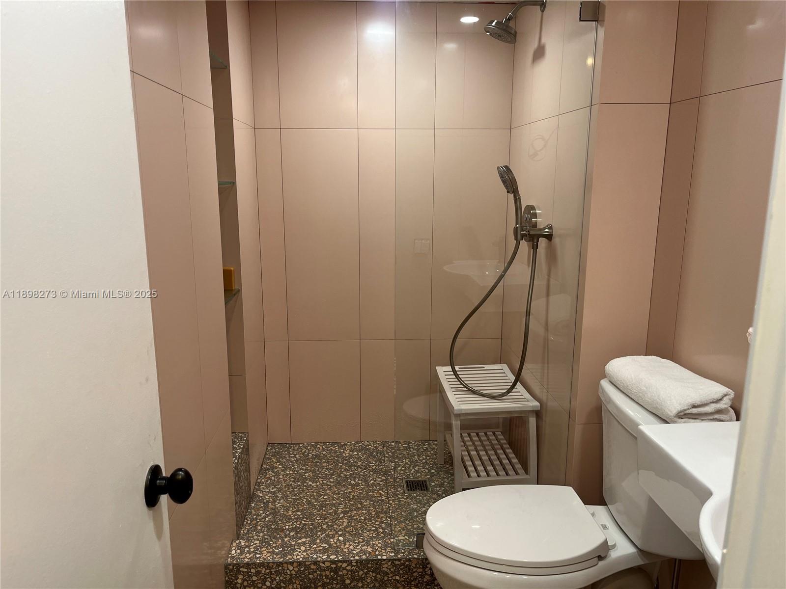 525 North Ocean Boulevard, Unit 1820 Pompano Beach, FL 33062 - Photo 12 of 18 a white toilet sitting next to a shower