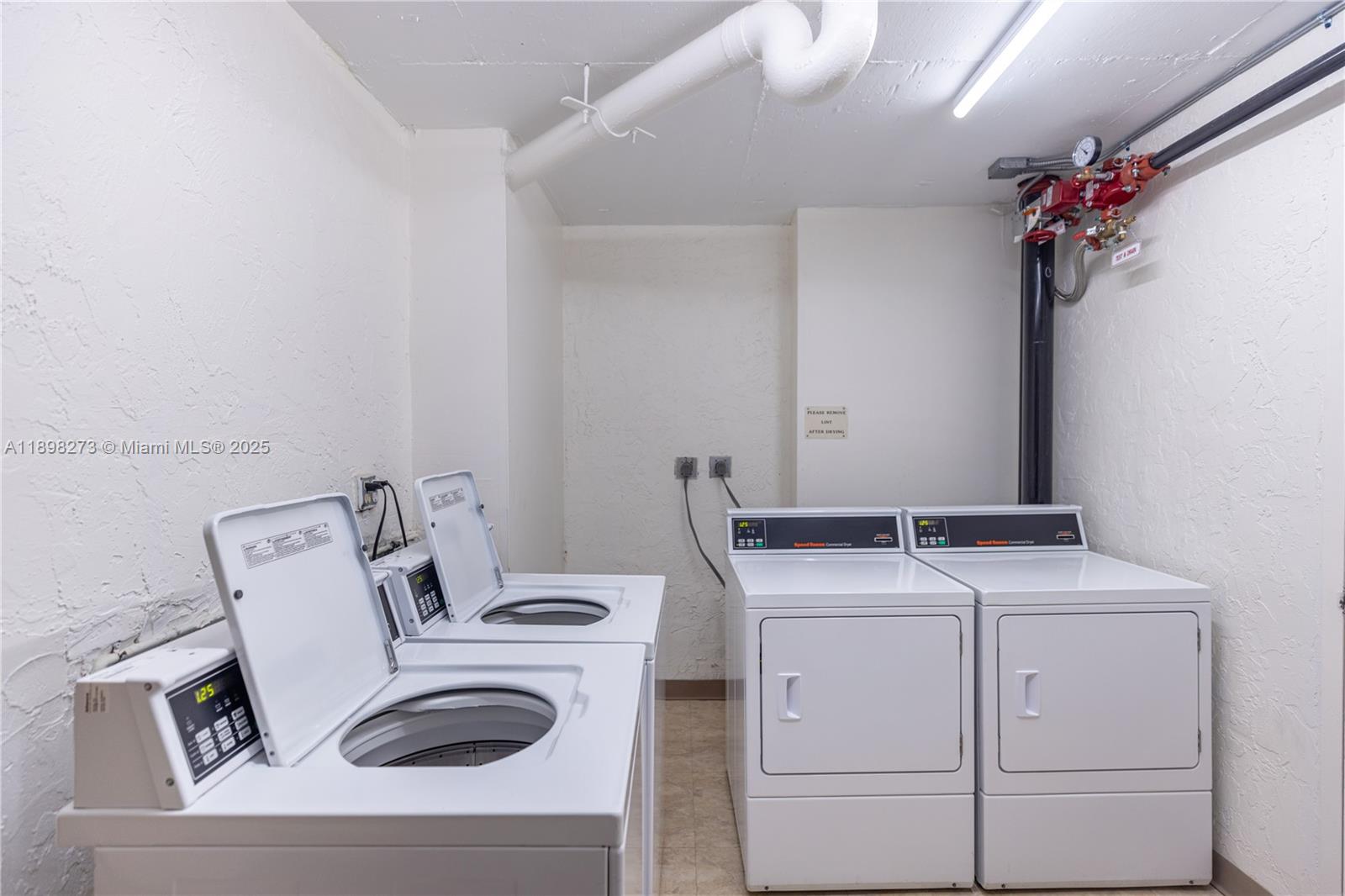 525 North Ocean Boulevard, Unit 1820 Pompano Beach, FL 33062 - Photo 14 of 18 a utility room with dryer and washer