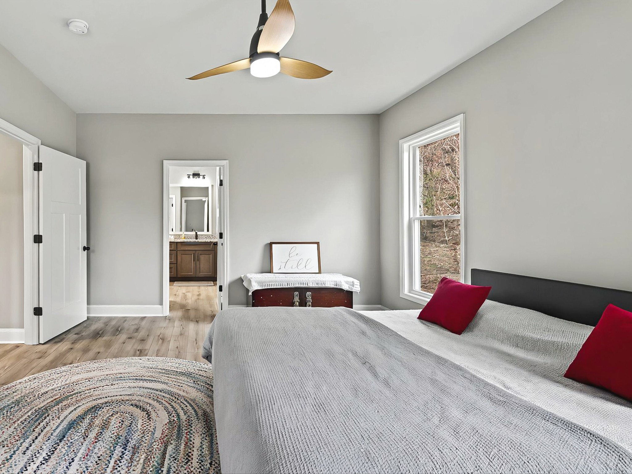 125 Charlie Howell Road Goodspring, TN 38460 - Photo 25 of 46 a bedroom with a large bed and a chandelier