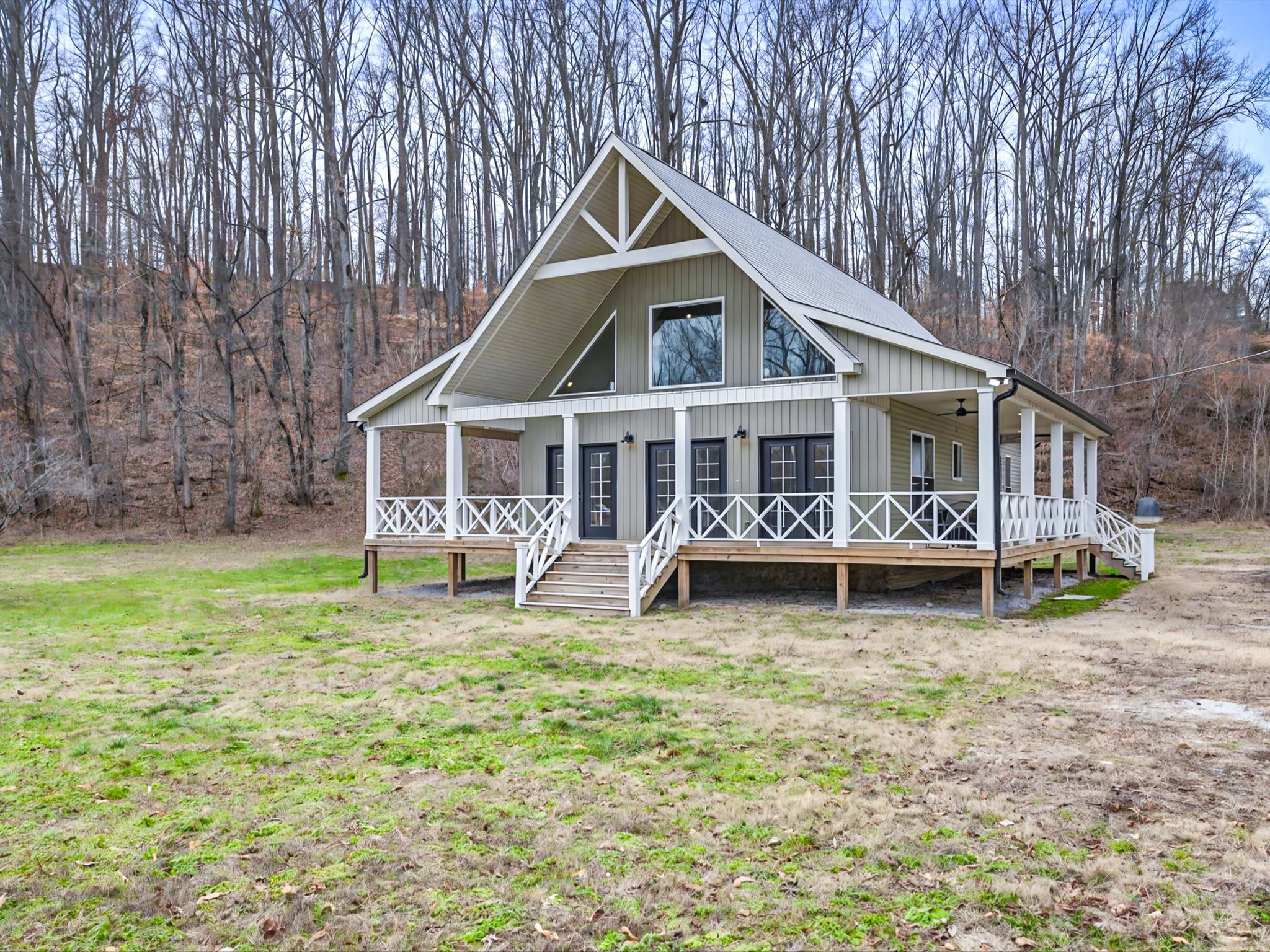 125 Charlie Howell Road Goodspring, TN 38460 - Photo 4 of 46 a front view of a house with garden