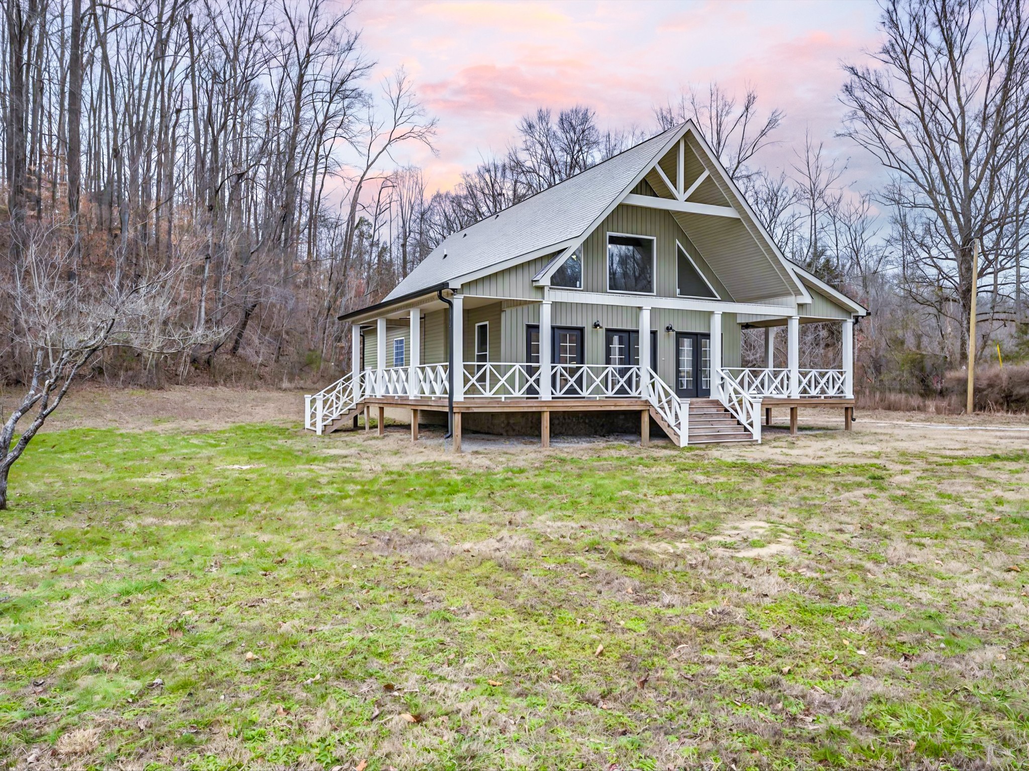 125 Charlie Howell Road Goodspring, TN 38460 - Photo 44 of 46 a front view of a house with a garden and trees