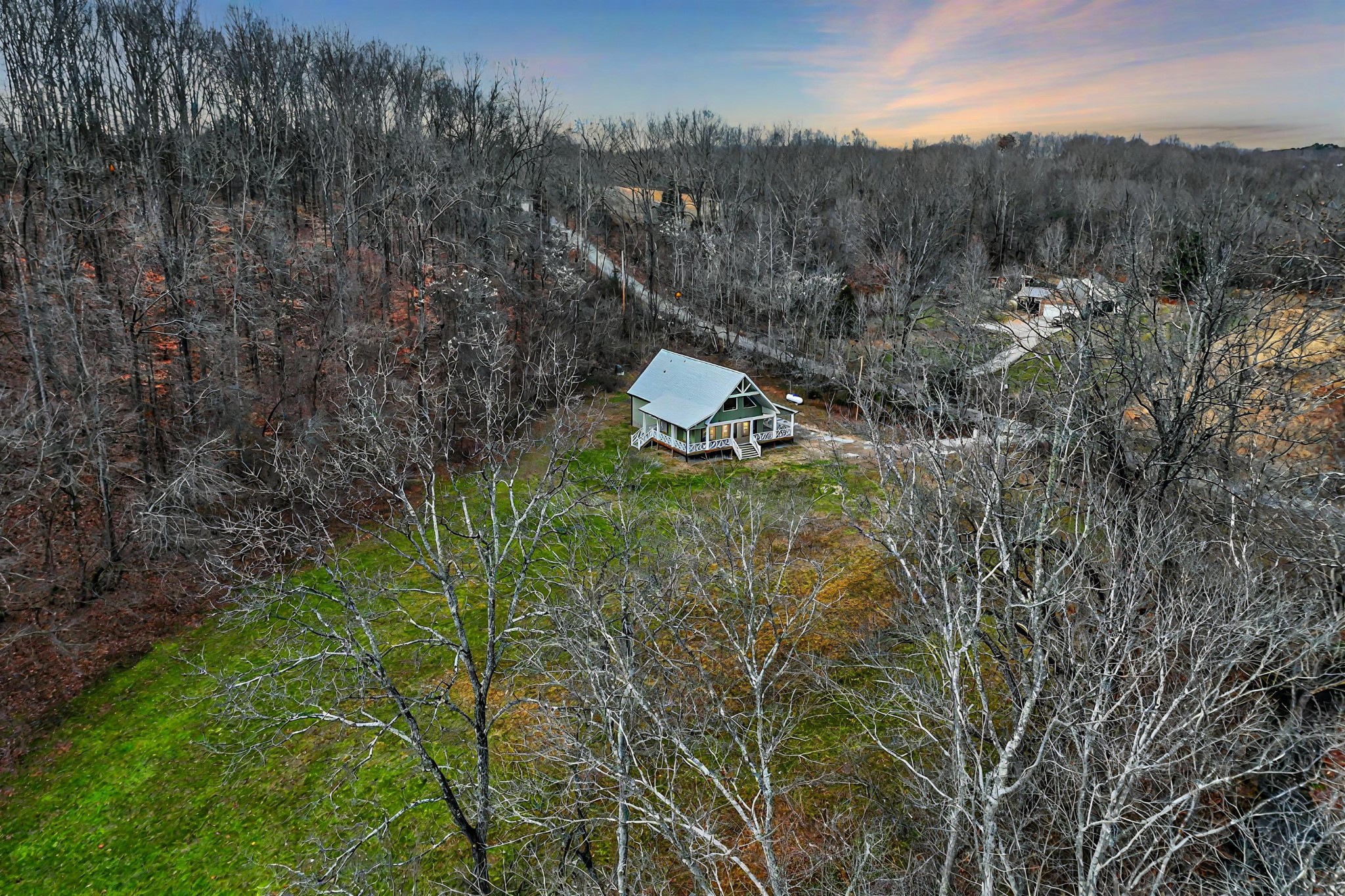 125 Charlie Howell Road Goodspring, TN 38460 - Photo 46 of 46 a view of a houses with a lush green forest