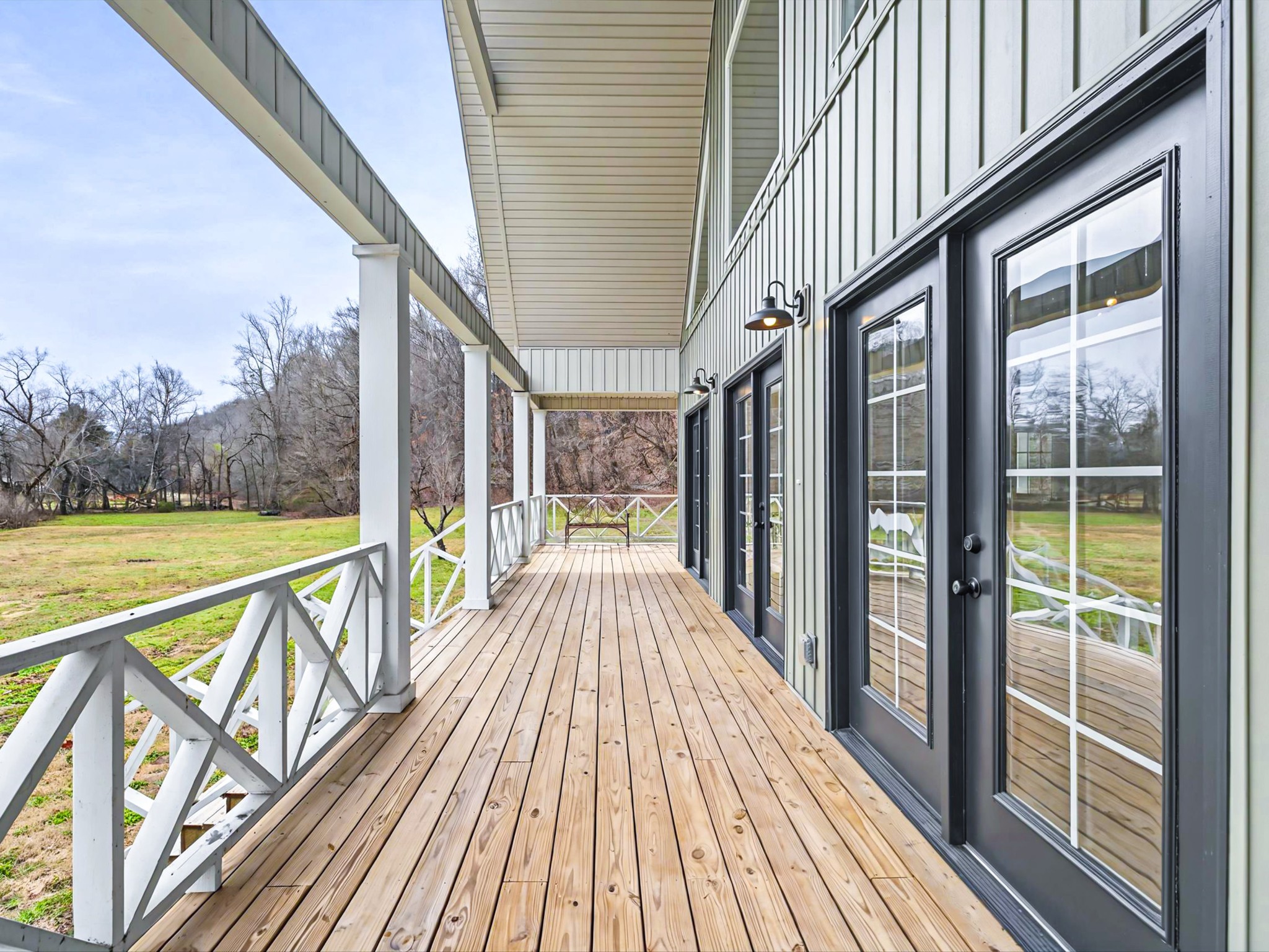 125 Charlie Howell Road Goodspring, TN 38460 - Photo 5 of 46 a view of balcony with floor to ceiling windows with wooden floor