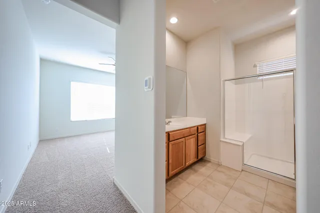 a utility room with cabinets washer and dryer