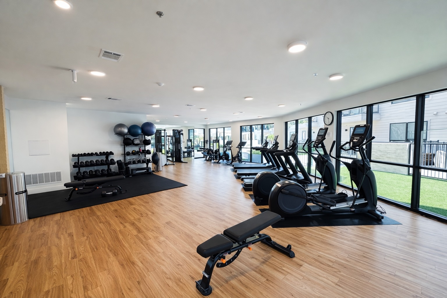 1701 Simond Avenue, Unit 625 Austin, TX 78723 - Photo 16 of 23 a room with gym equipment and wooden floor