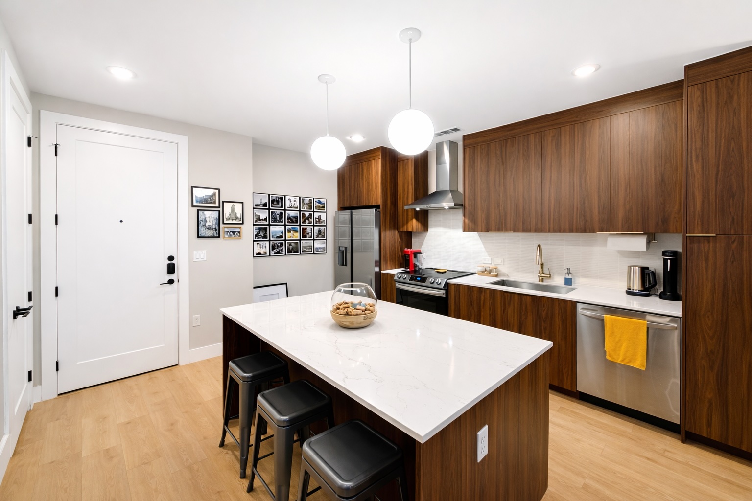 1701 Simond Avenue, Unit 625 Austin, TX 78723 - Photo 19 of 23 a kitchen with a dining table cabinets appliances and wooden floor