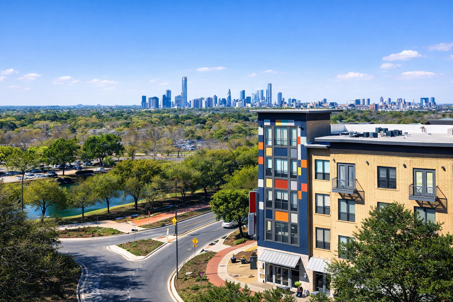 a view of a city with tall buildings and trees in the background