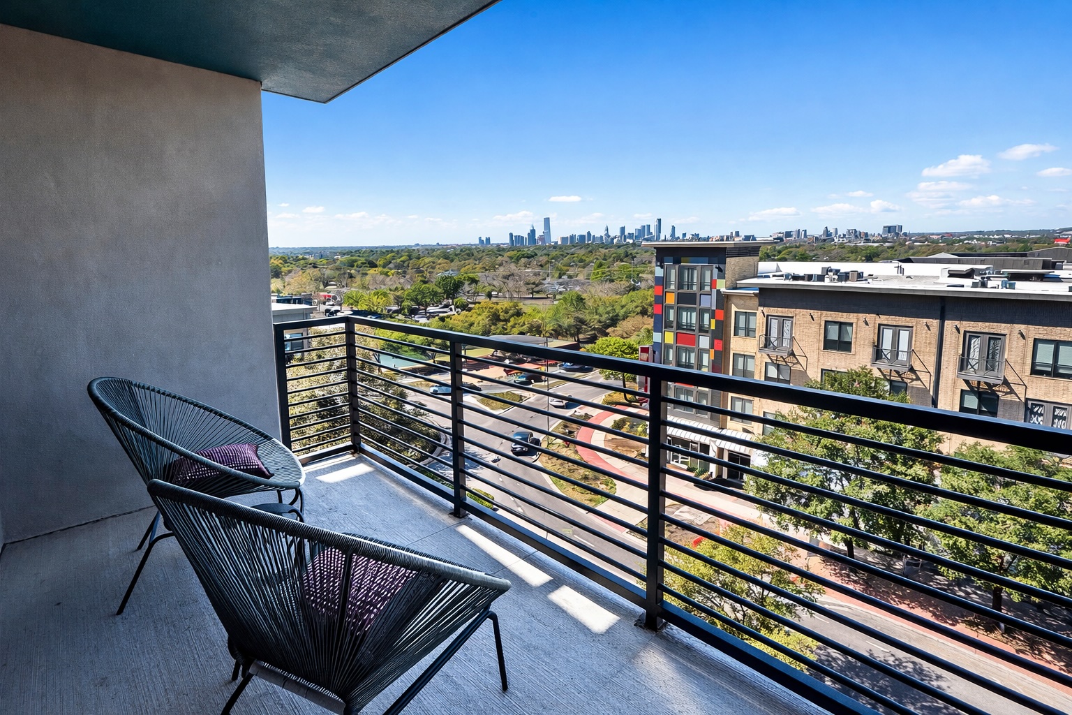 1701 Simond Avenue, Unit 625 Austin, TX 78723 - Photo 9 of 23 a view of a balcony with wooden benches