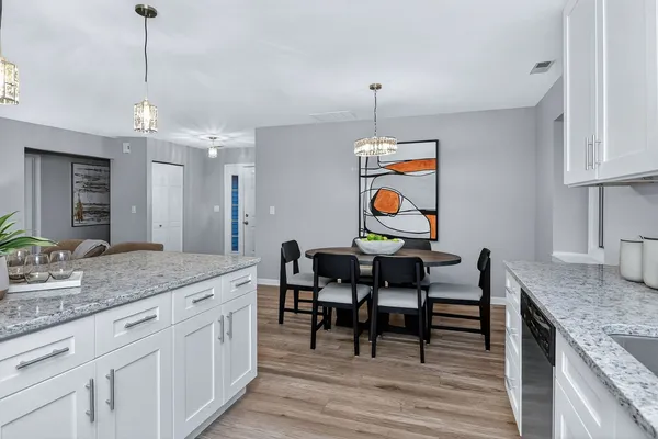 a view of dining table and chairs in a kitchen