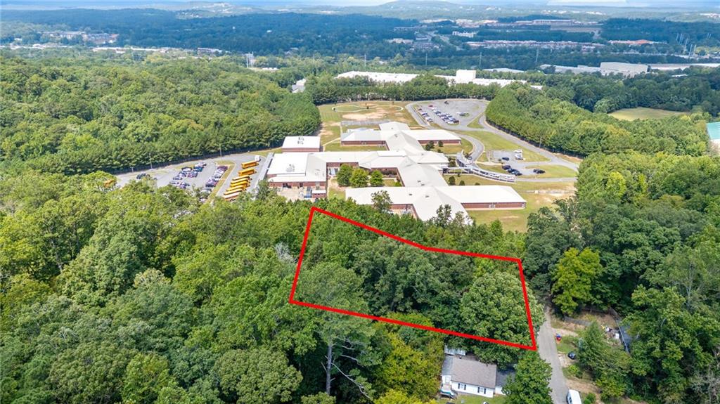 0 Reed Street Canton, GA 30114 - Photo 3 of 13 an aerial view of a house with a yard and lake view