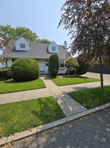 a view of a street with a building in the background