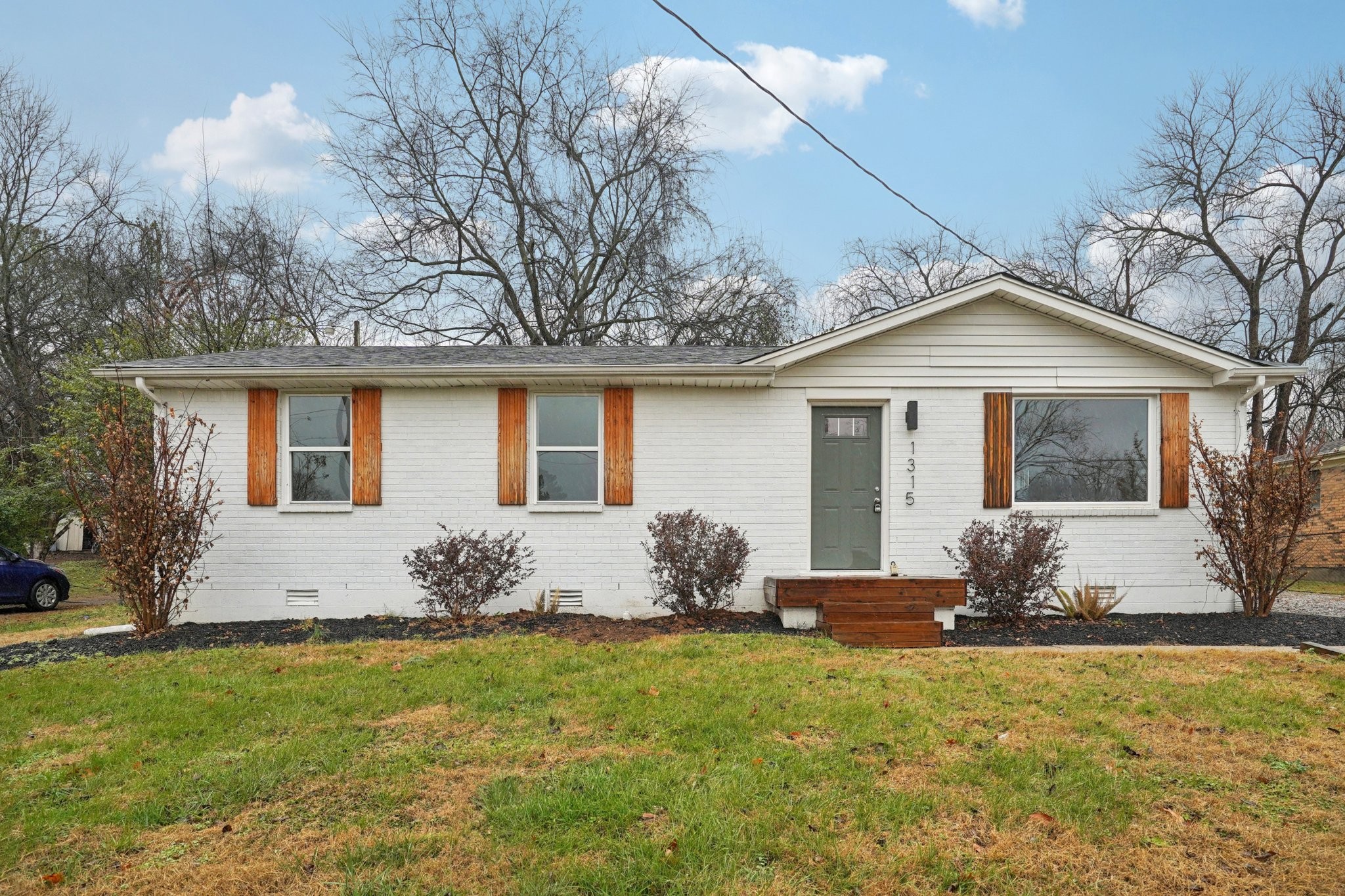 1315 Robin Hill Road Franklin, TN 37064 - Photo 1 of 25 a front view of a house with garden