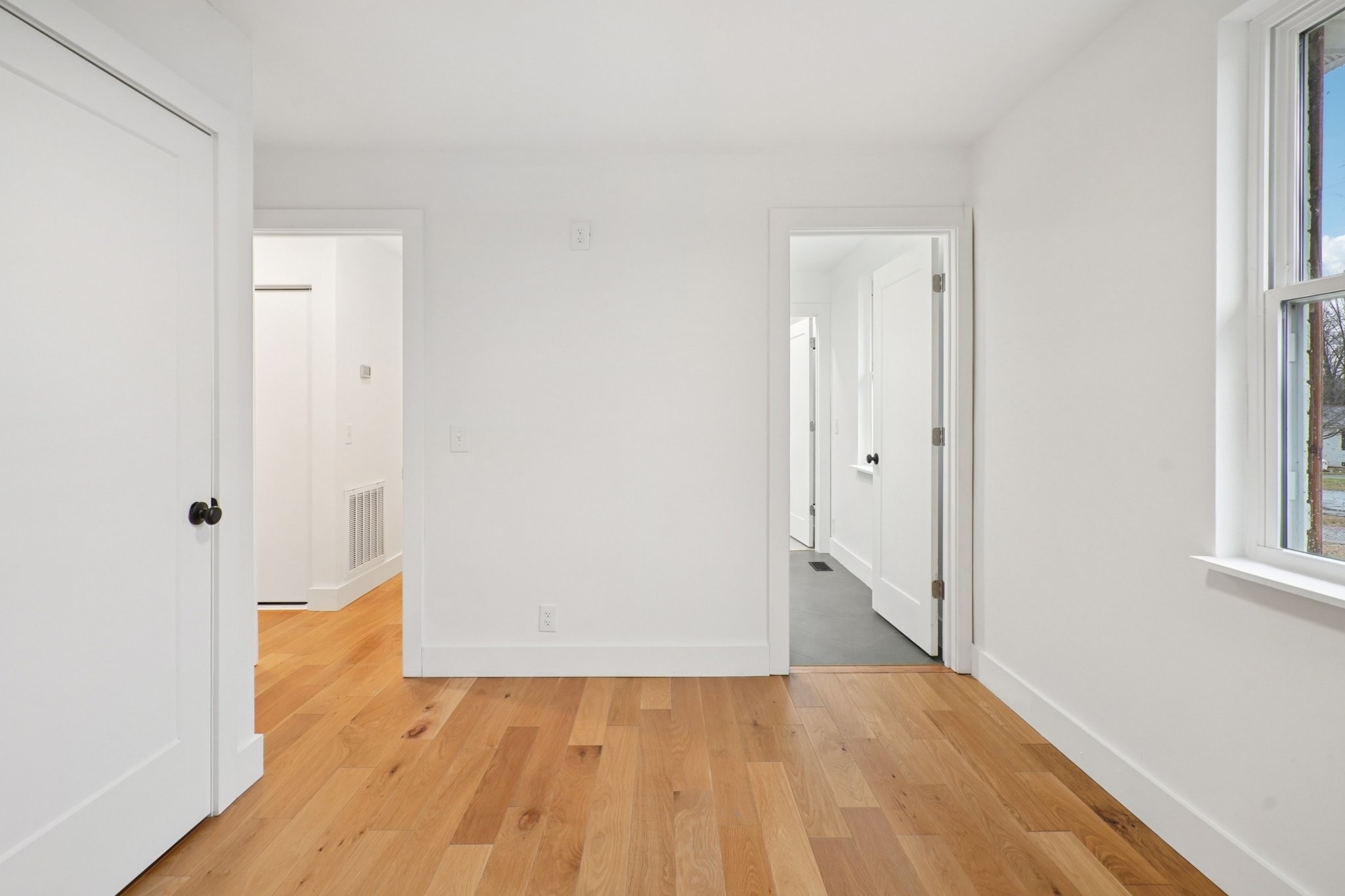 1315 Robin Hill Road Franklin, TN 37064 - Photo 11 of 25 a view of an empty room with wooden floor and a window