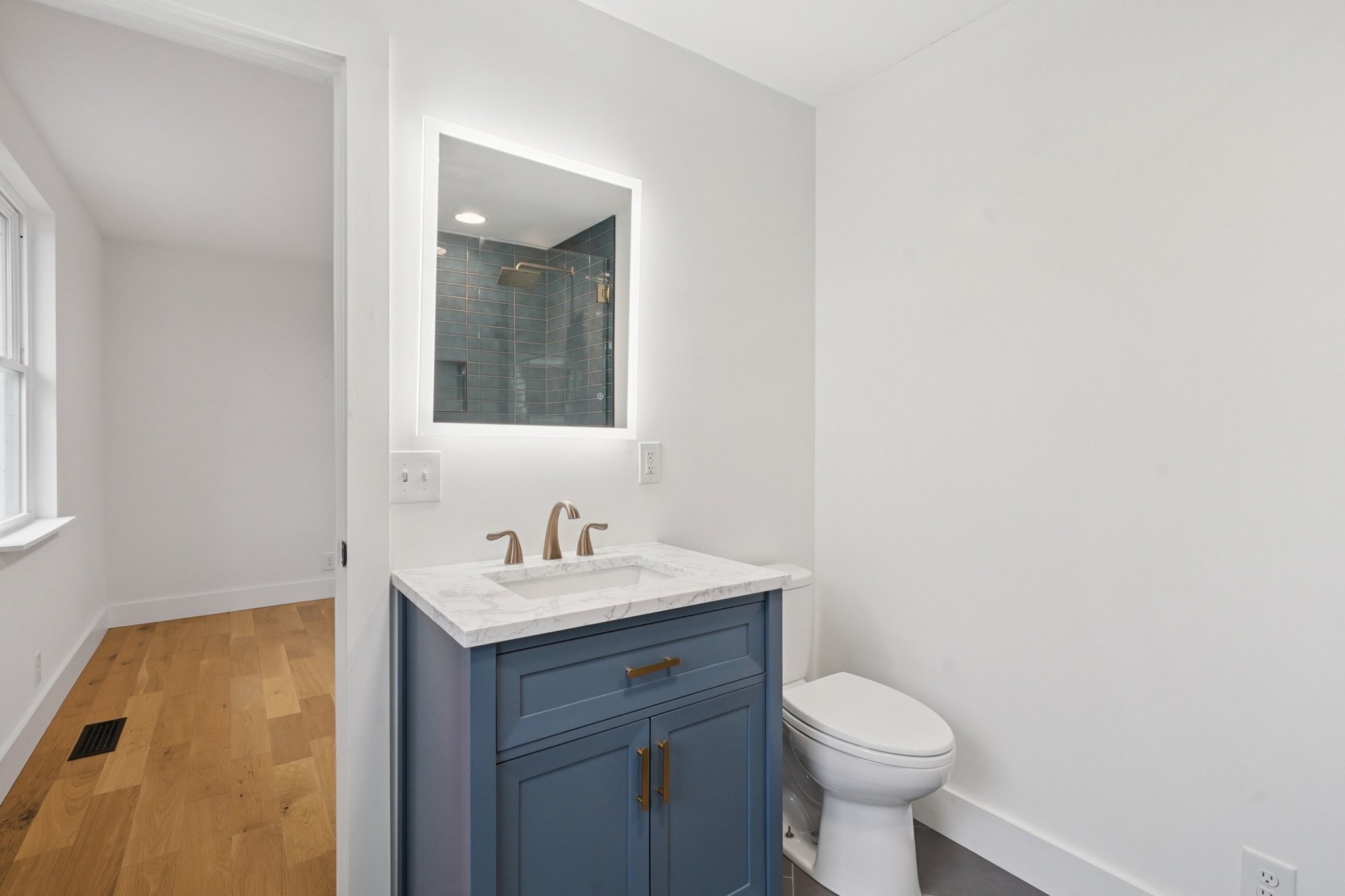 1315 Robin Hill Road Franklin, TN 37064 - Photo 13 of 25 a bathroom with a sink toilet and a mirror