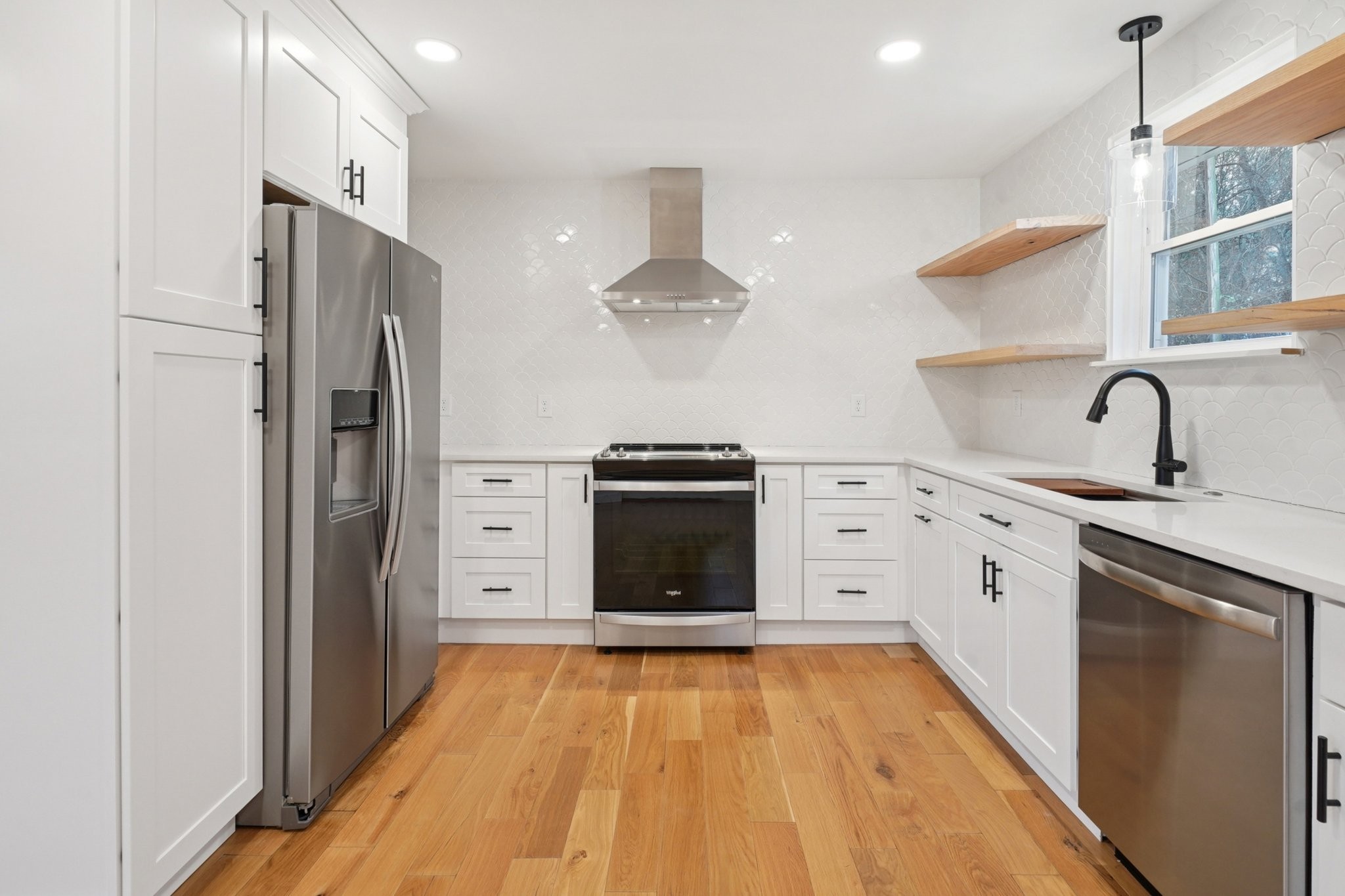 1315 Robin Hill Road Franklin, TN 37064 - Photo 8 of 25 a kitchen with stainless steel appliances granite countertop a refrigerator and a stove top oven