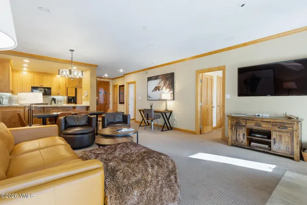a living room with furniture and a flat screen tv
