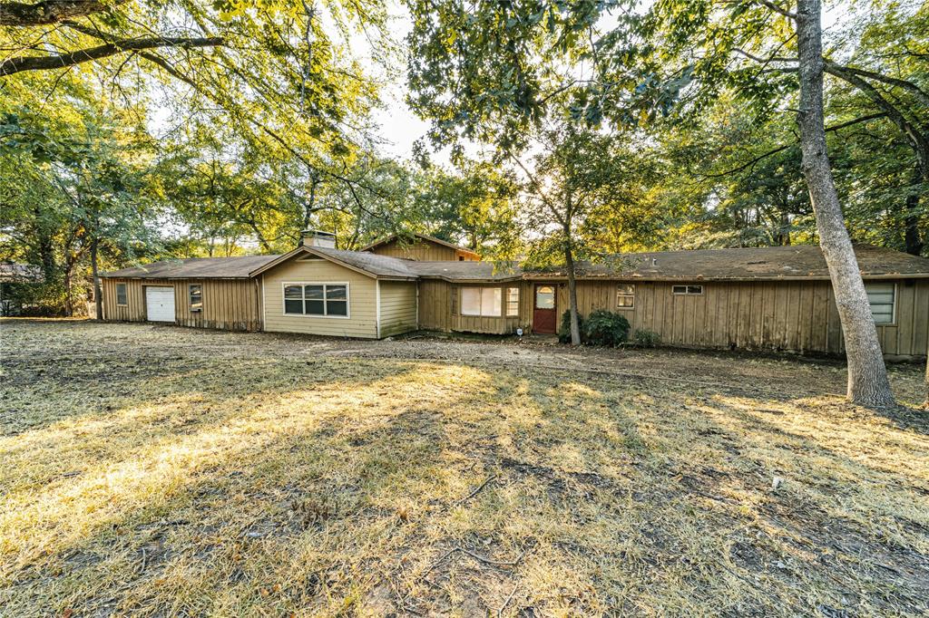 2155 Hickory Trace Mabank, TX 75156 - Photo 1 of 1 a front view of a house with a yard