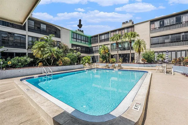 a view of a swimming pool with a patio