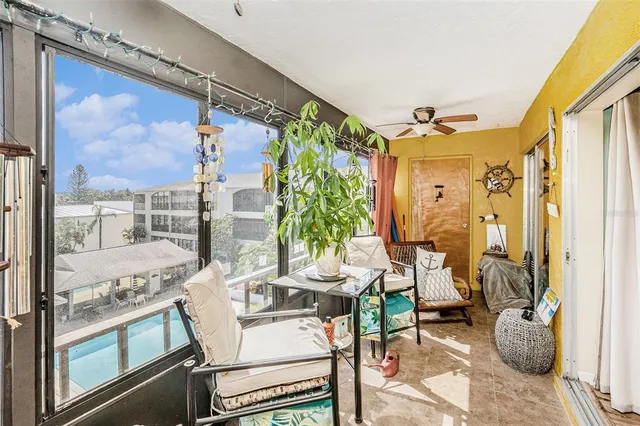 a view of a dining room with furniture a chandelier and wooden floor