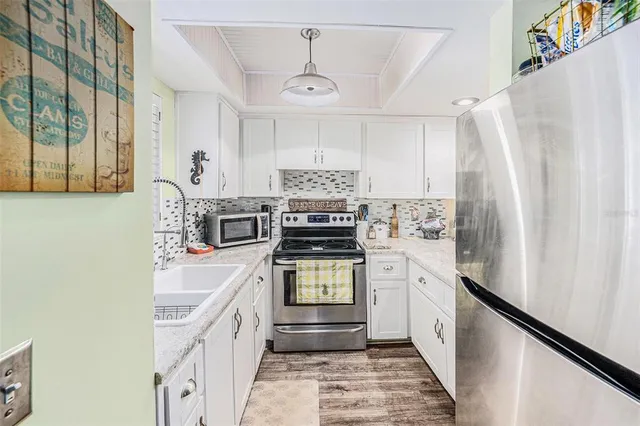 a bathroom with a sink a mirror and shower