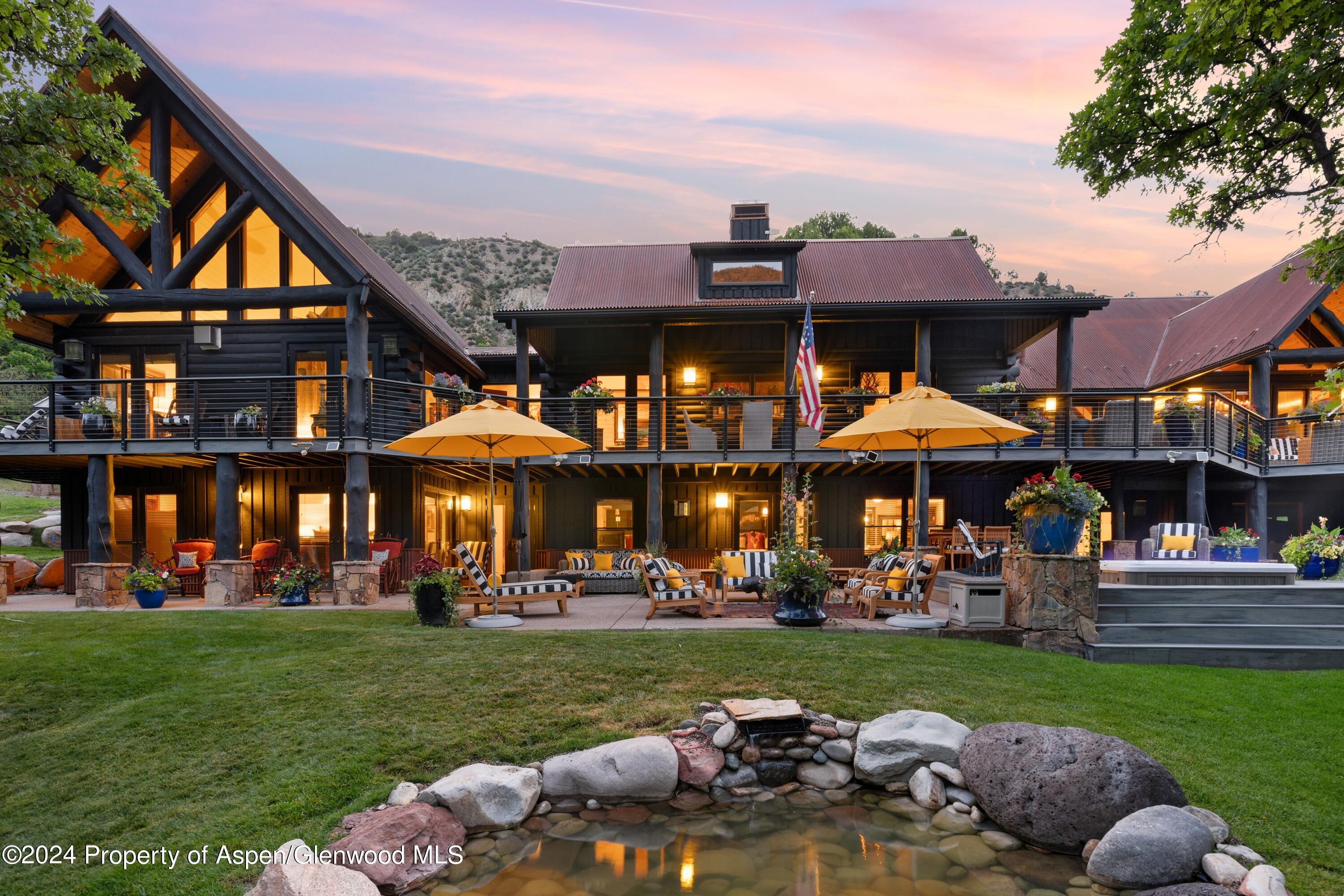 a front view of a building with a garden
