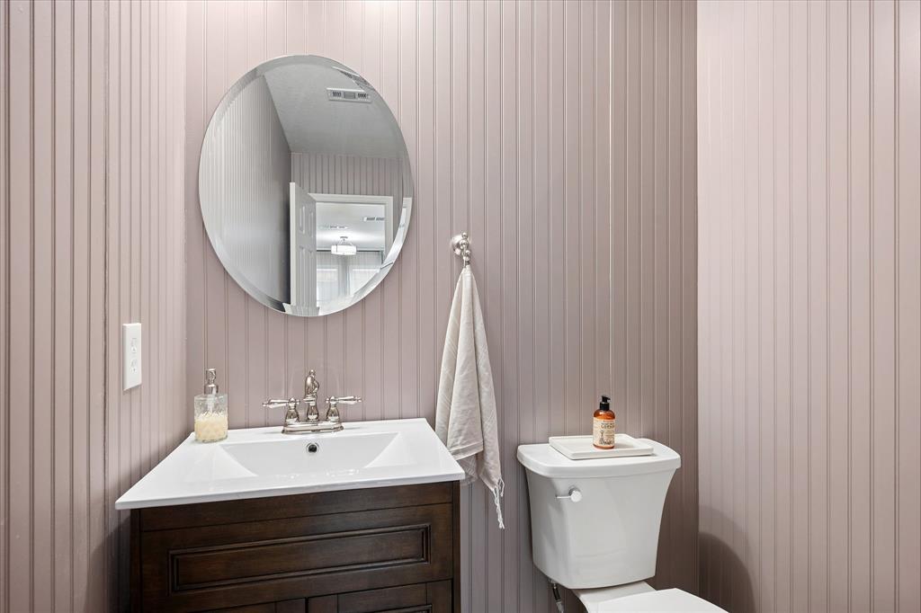 13837 High Mesa Road Fort Worth, TX 76262 - Photo 14 of 25 a bathroom with a sink a toilet and a mirror