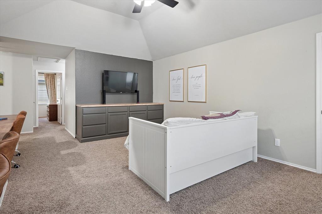 13837 High Mesa Road Fort Worth, TX 76262 - Photo 15 of 25 a living room with furniture and a flat screen tv