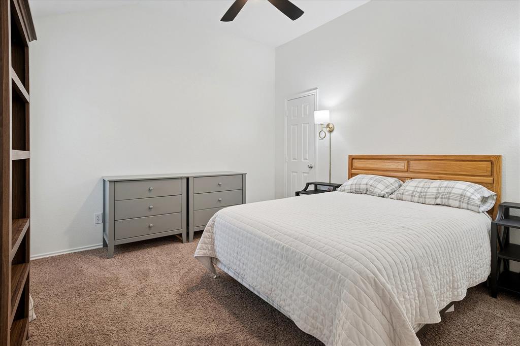 13837 High Mesa Road Fort Worth, TX 76262 - Photo 18 of 25 a bedroom with a bed and a night stand