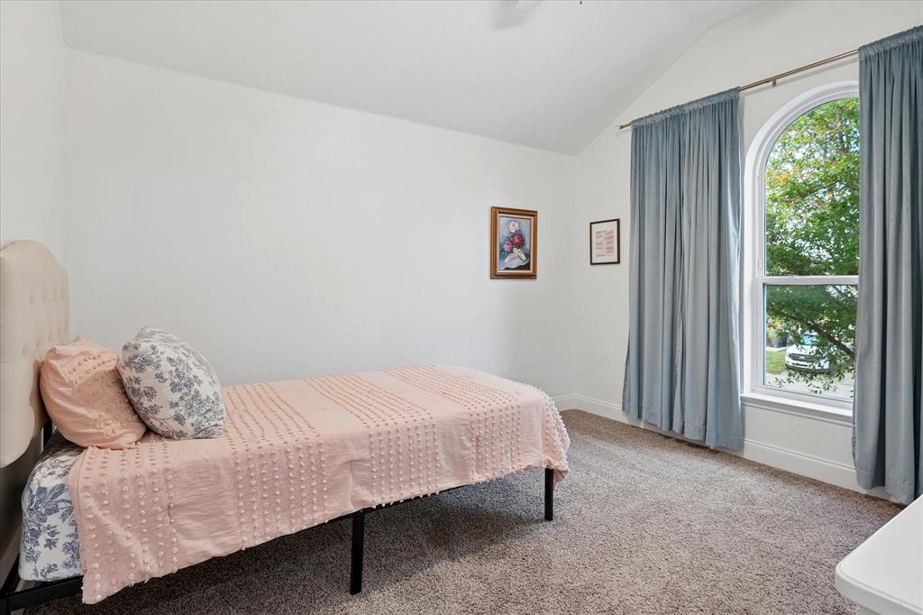 13837 High Mesa Road Fort Worth, TX 76262 - Photo 19 of 25 a bedroom with a bed and a window