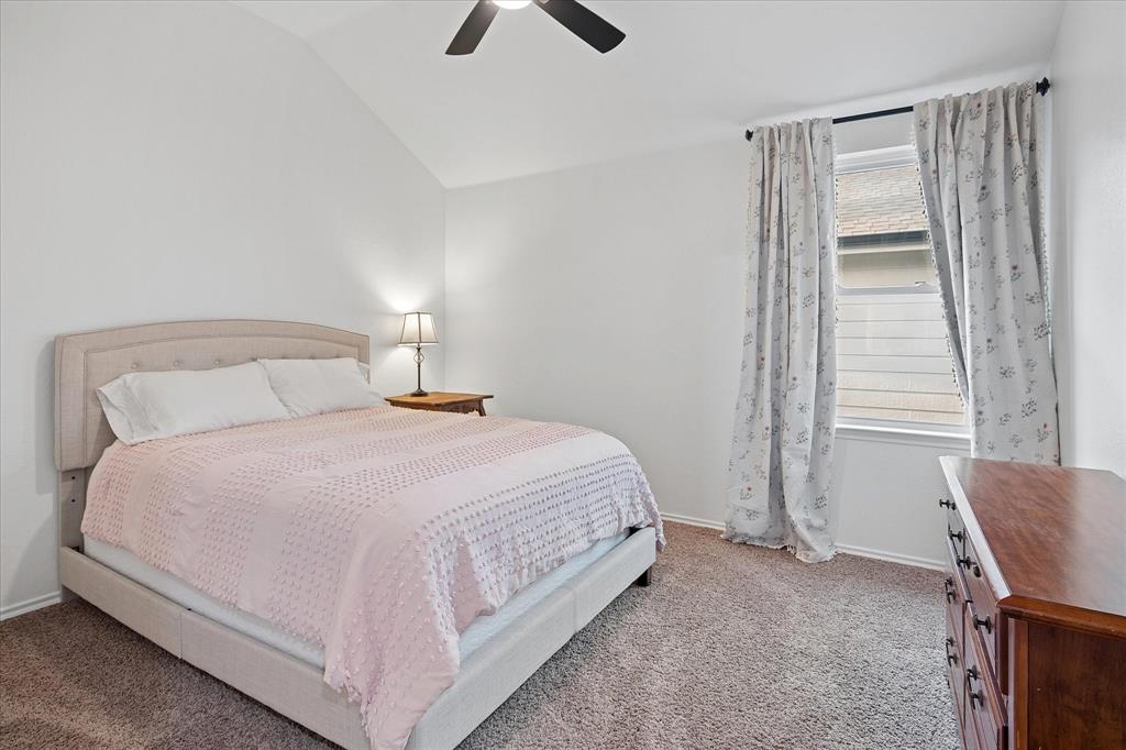 13837 High Mesa Road Fort Worth, TX 76262 - Photo 20 of 25 a bedroom with a bed and a window