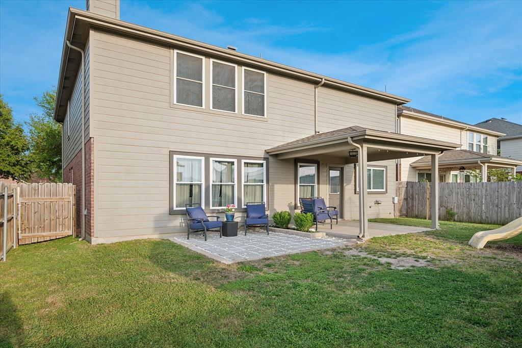 13837 High Mesa Road Fort Worth, TX 76262 - Photo 23 of 25 a front view of a house with a yard and porch